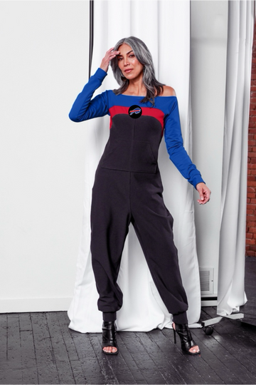 Off shoulder jumpsuit with blue sleeves, red stripe, black body, and Buffalo logo on the center of the chest with front patch pockets. 