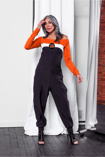 Off shoulder jumpsuit with orange sleeves, white stripe, black body, and 
Bengals logo on the center of the chest with front patch pockets. 